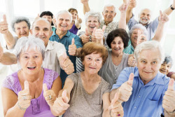 Large group of cheerful seniors showing thumbs up and looking at the camera.  [url=http://www.istockphoto.com/search/lightbox/9786738][img]http://dl.dropbox.com/u/40117171/group.jpg[/img][/url]