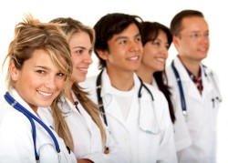 young doctors lined up isolated over white background